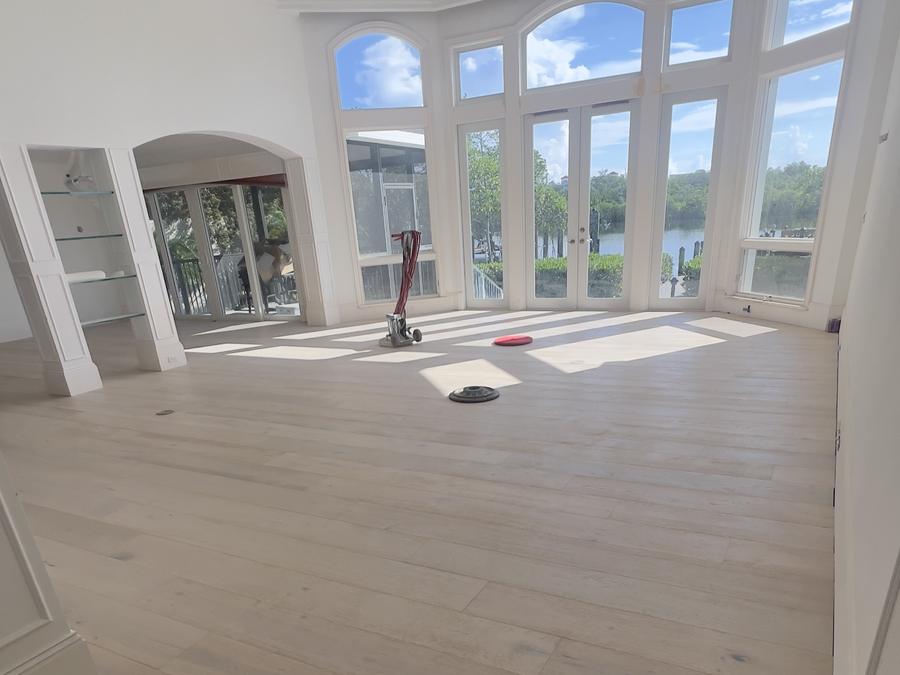 Wide-plank white oak floor in a waterfront living room