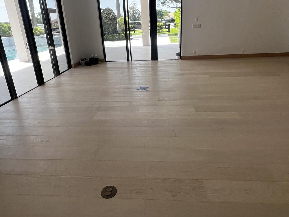 New wide-plank white oak floor in a modern Palm Beach home