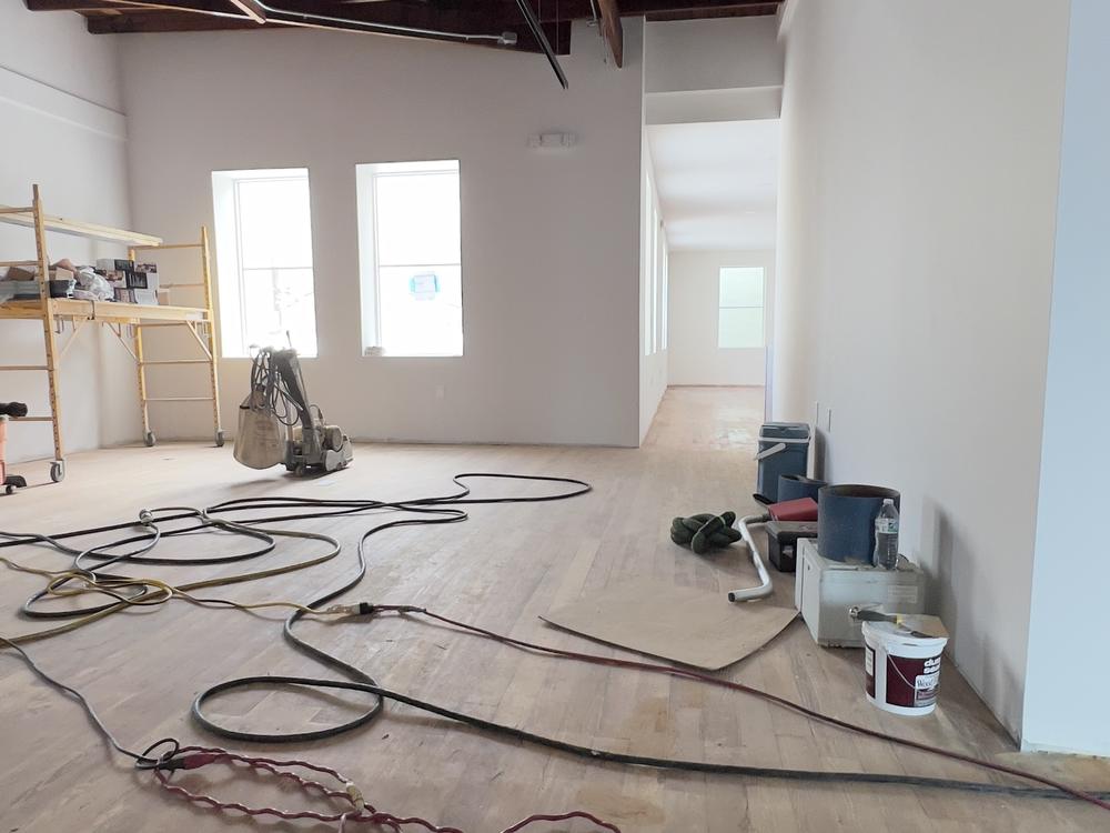 Wide-plank white oak floor in a waterfront Palm Beach living room, mid-finish
